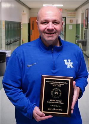 Marc Spacone holding principal of the year award 